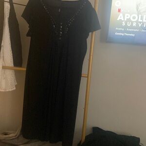 Sexy black dress. No size tag but fits between 1x and 2X